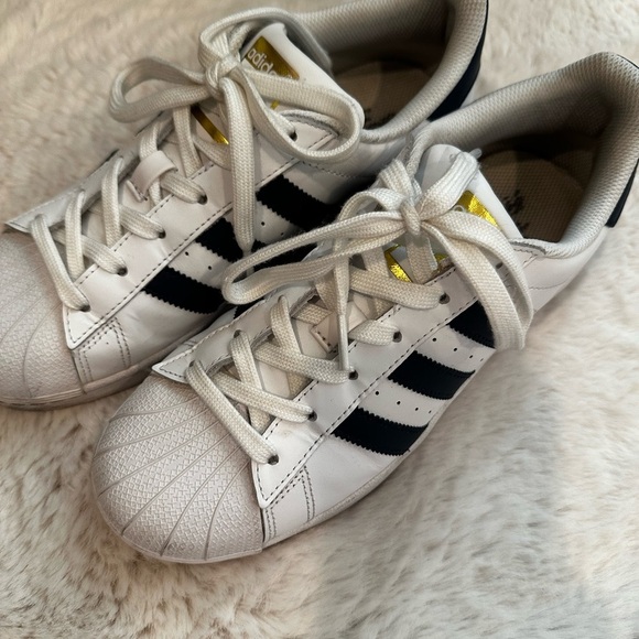 Adidas women’s White and Navy Sneakers with Gold Accents